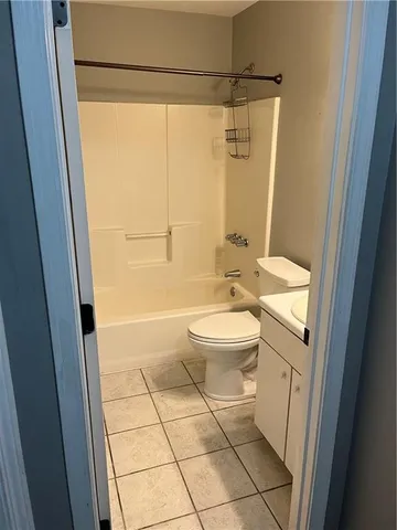 a bathroom with a tub and a window