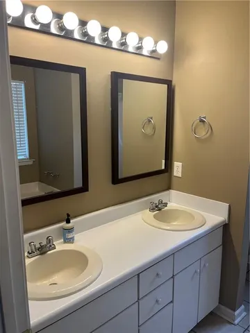 a view of a hallway with wooden floor and stairs