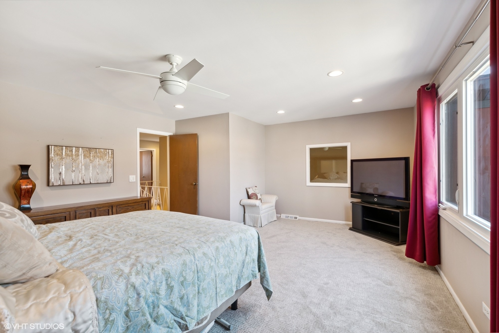 3905 Rugen Road Glenview, IL 60025 - Photo 16 of 31 a bedroom with a bed and a television