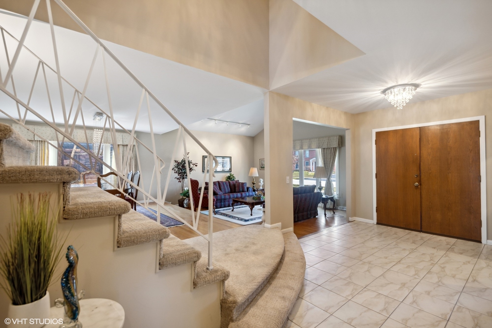 3905 Rugen Road Glenview, IL 60025 - Photo 3 of 31 a view of a livingroom with furniture and a chandelier