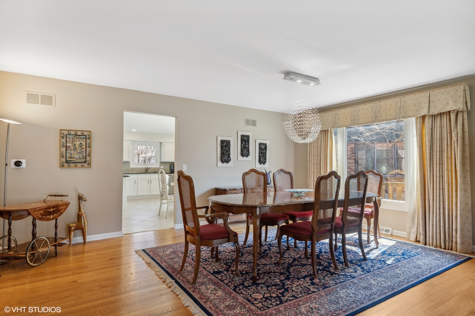 3905 Rugen Road Glenview, IL 60025 - Photo 6 of 31 a view of a a dining room with furniture window and wooden floor