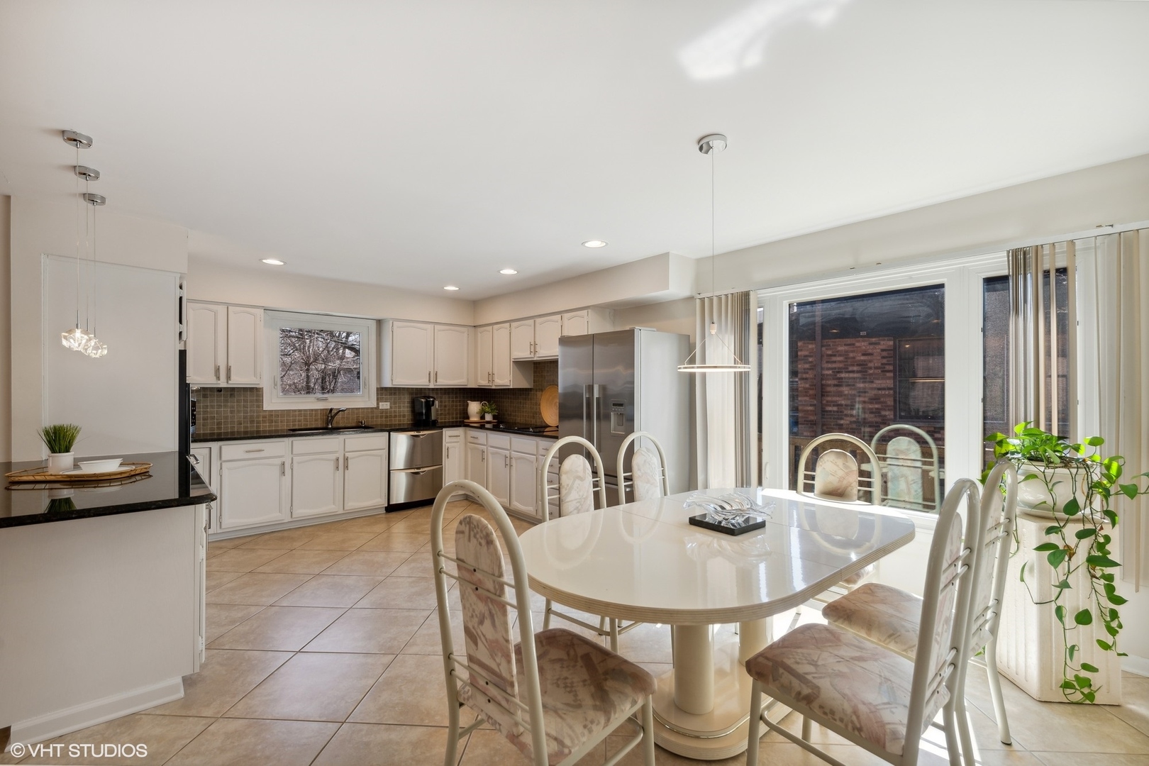 3905 Rugen Road Glenview, IL 60025 - Photo 8 of 31 a kitchen with a table and chairs in it