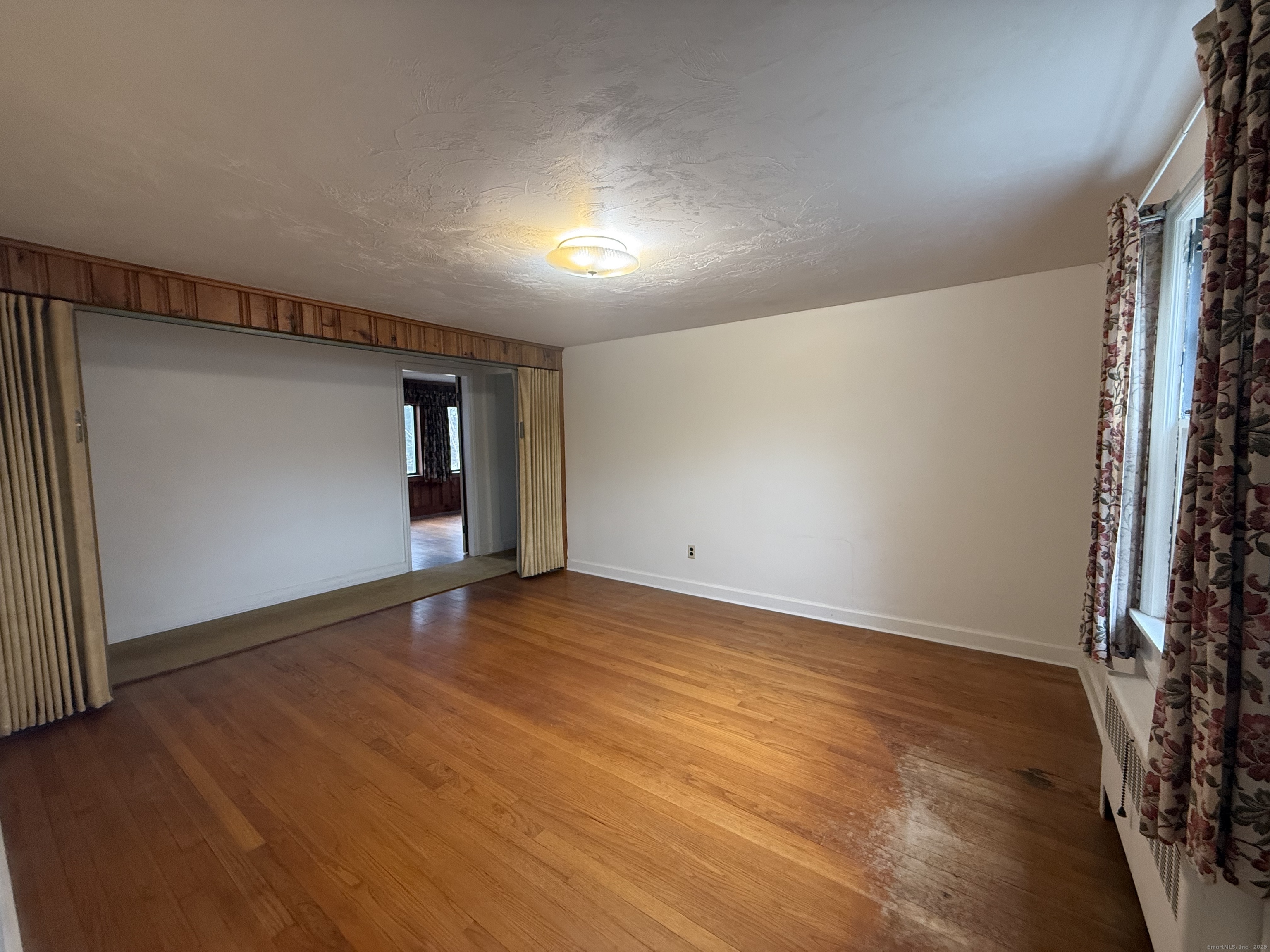 10 Top View Drive Thompson, CT 06262 - Photo 16 of 34 a view of an empty room with wooden floor and a window