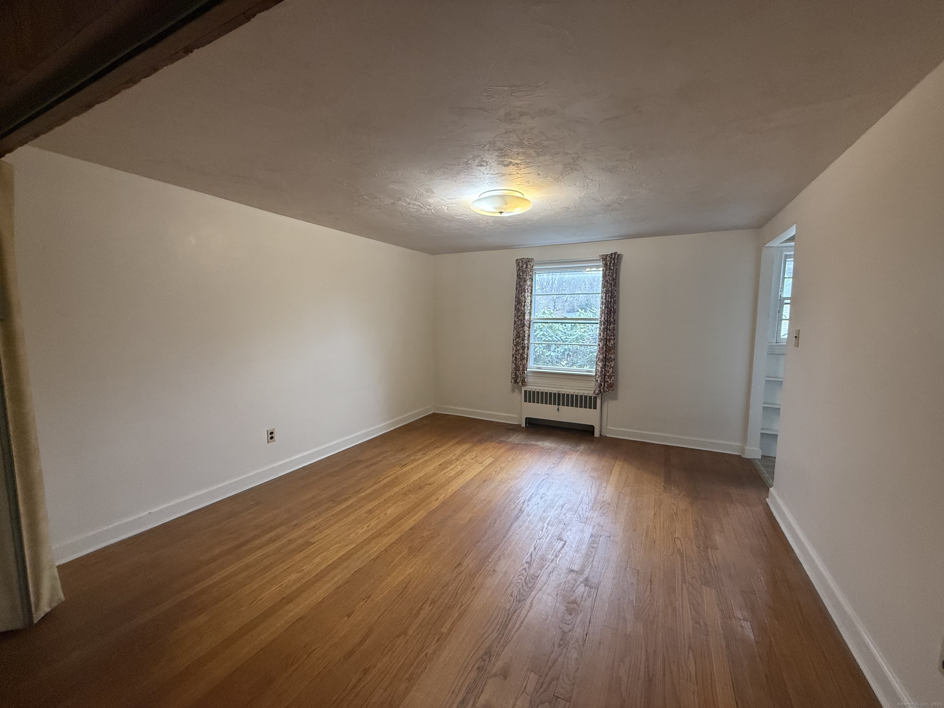 10 Top View Drive Thompson, CT 06262 - Photo 18 of 34 an empty room with wooden floor and windows