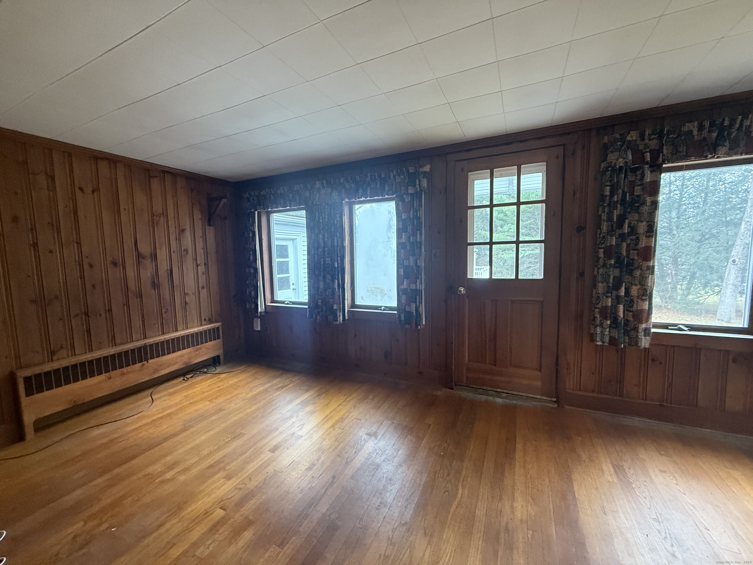 10 Top View Drive Thompson, CT 06262 - Photo 19 of 34 an empty room with wooden floor and windows