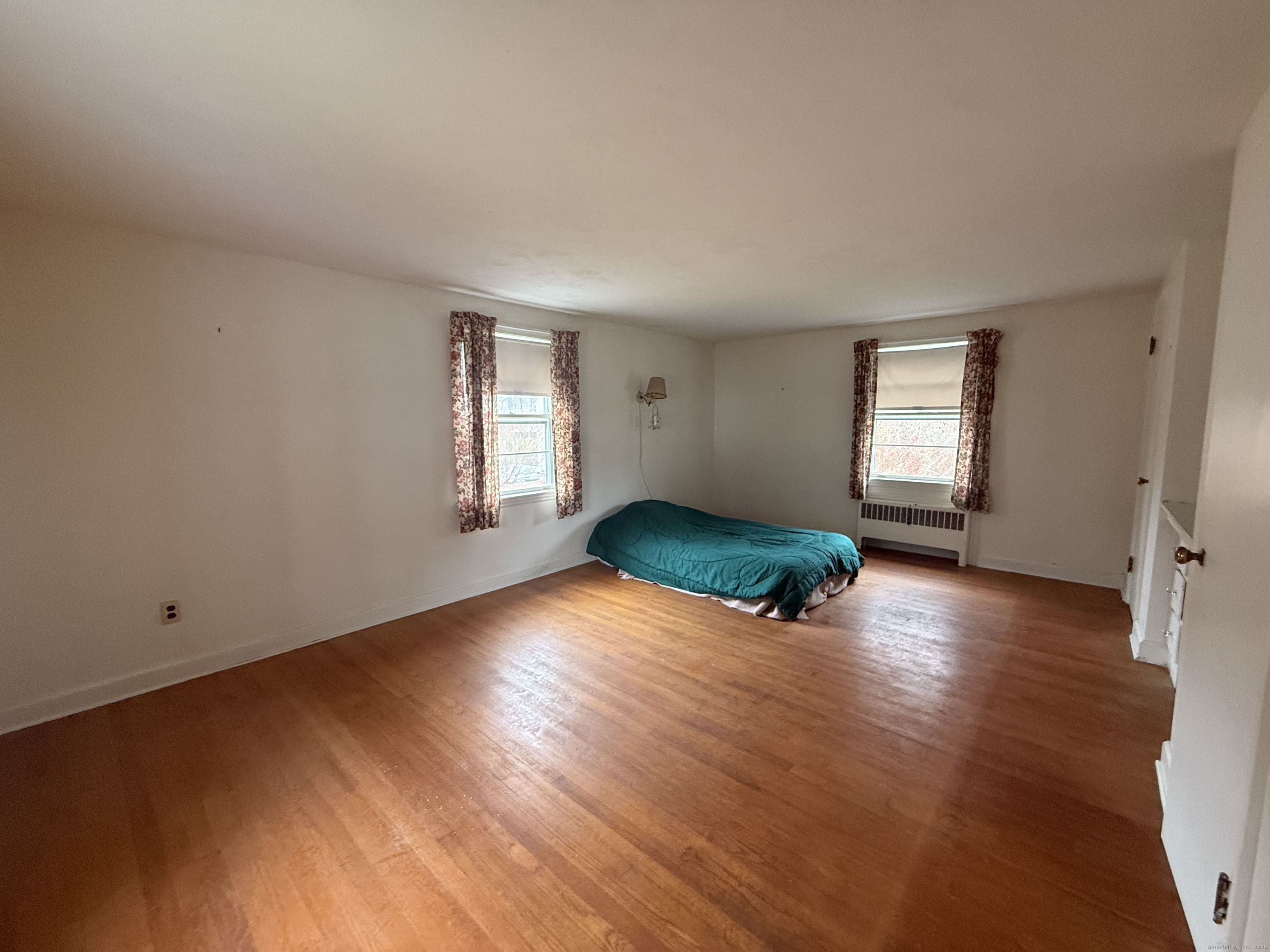 10 Top View Drive Thompson, CT 06262 - Photo 22 of 34 an empty room with wooden floor and windows