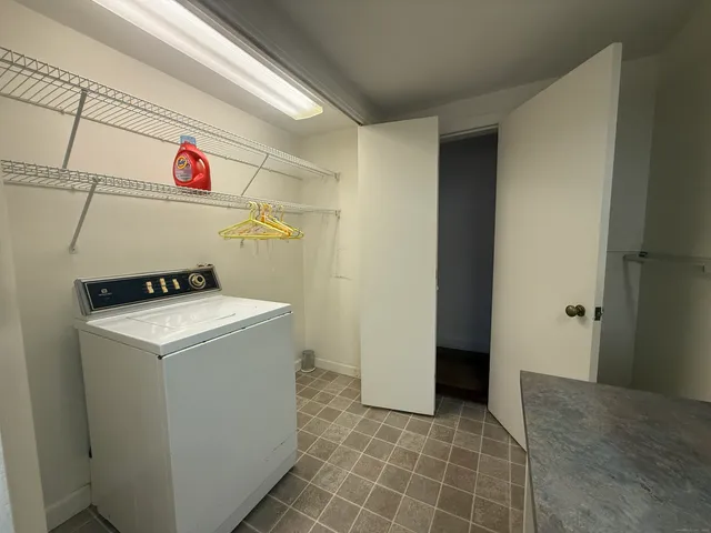 a view of empty room with a fireplace