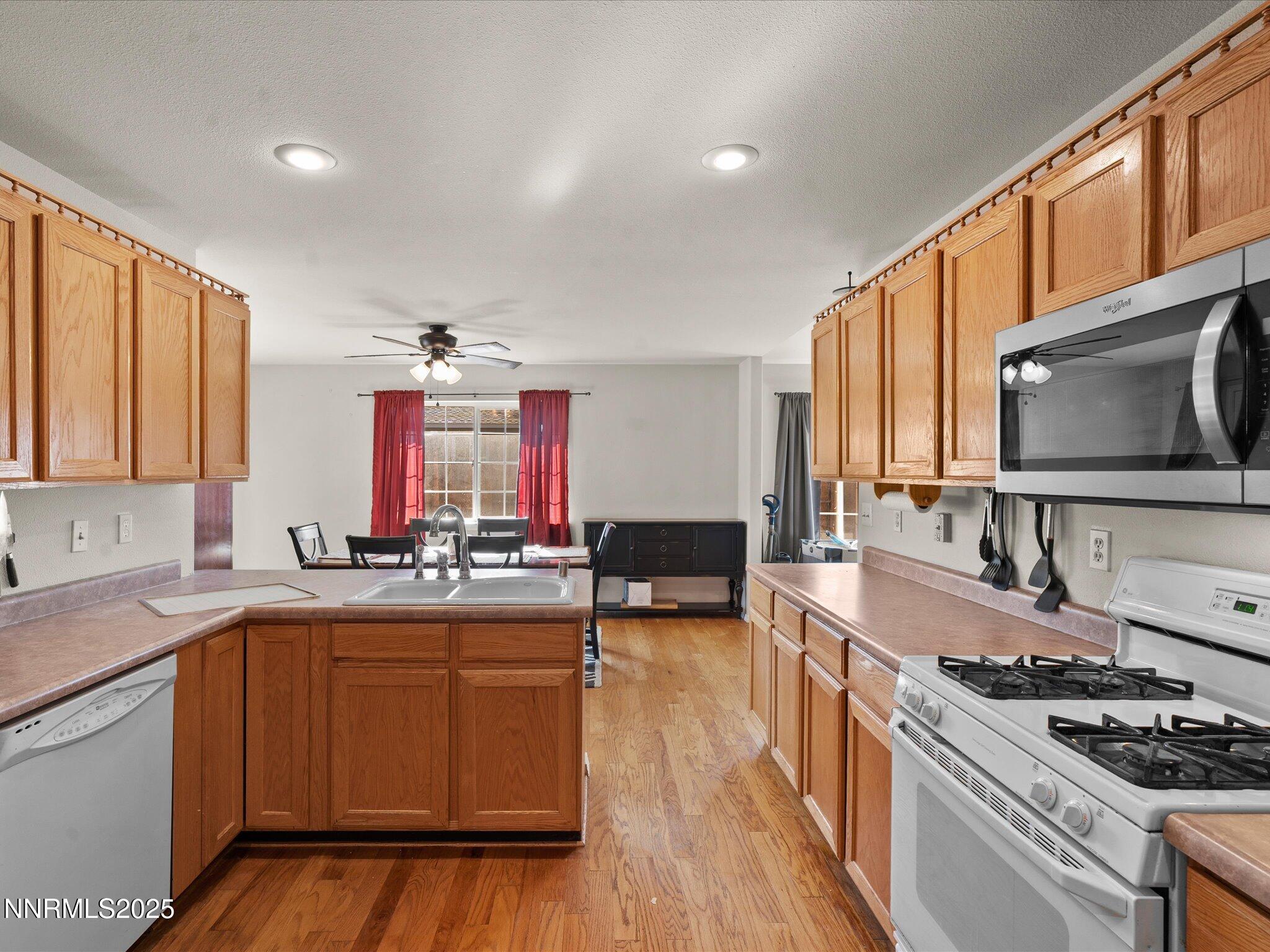 1819 Bogie Court Fernley, NV 89408 - Photo 15 of 46 a kitchen with sink stove and cabinets