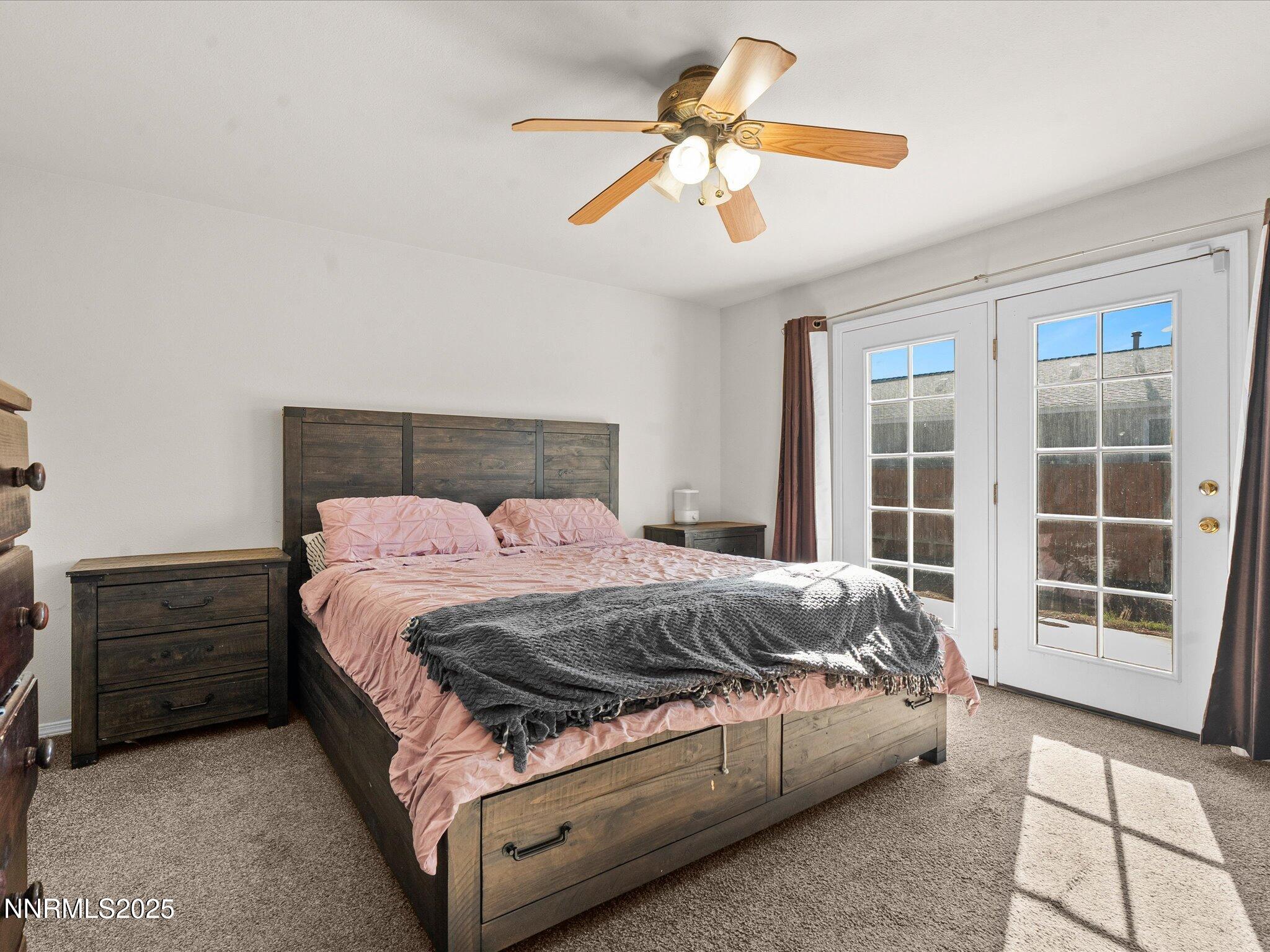 1819 Bogie Court Fernley, NV 89408 - Photo 18 of 46 a spacious bedroom with a bed a window and closet