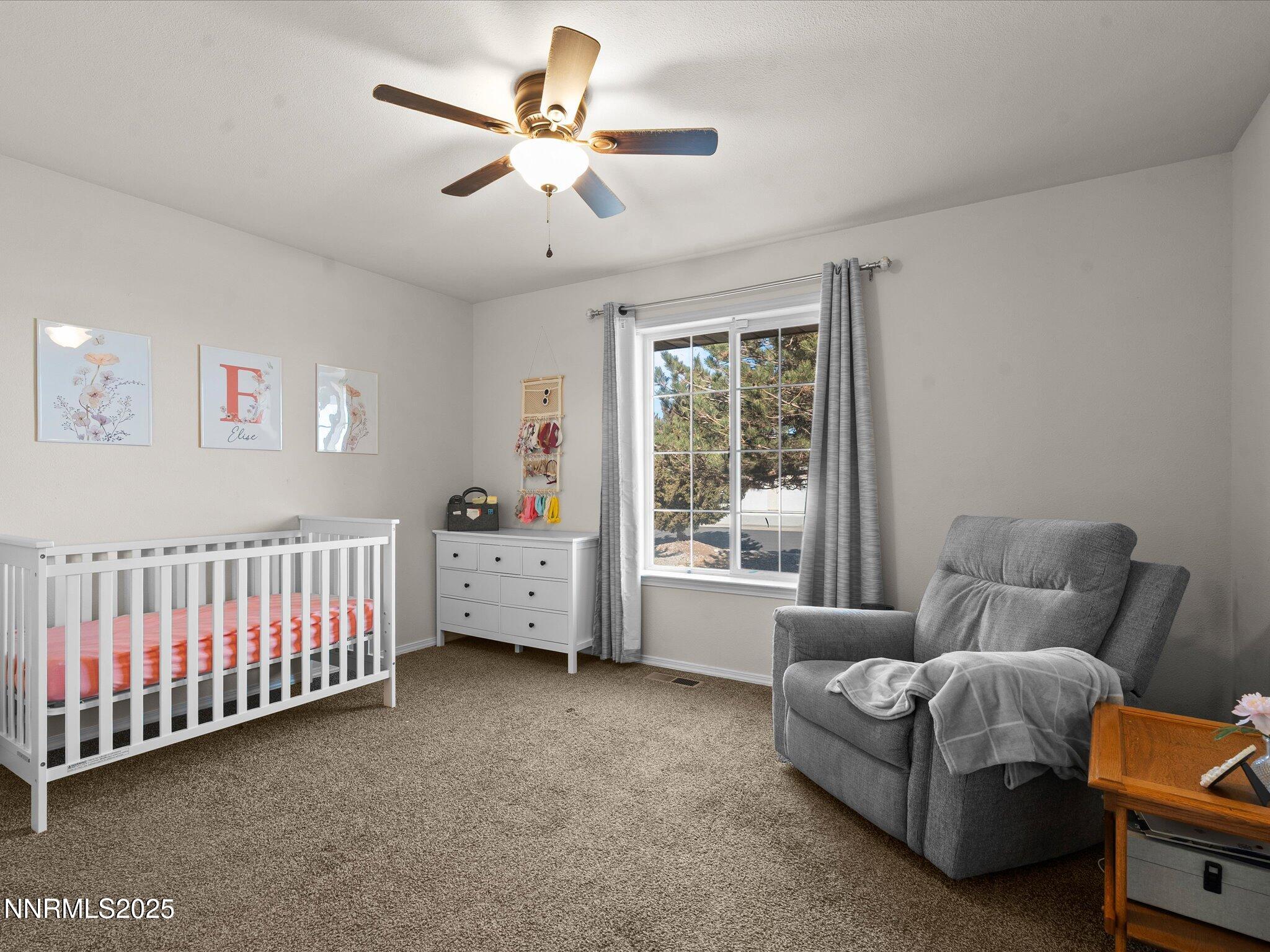 1819 Bogie Court Fernley, NV 89408 - Photo 27 of 46 a bedroom with furniture and a window