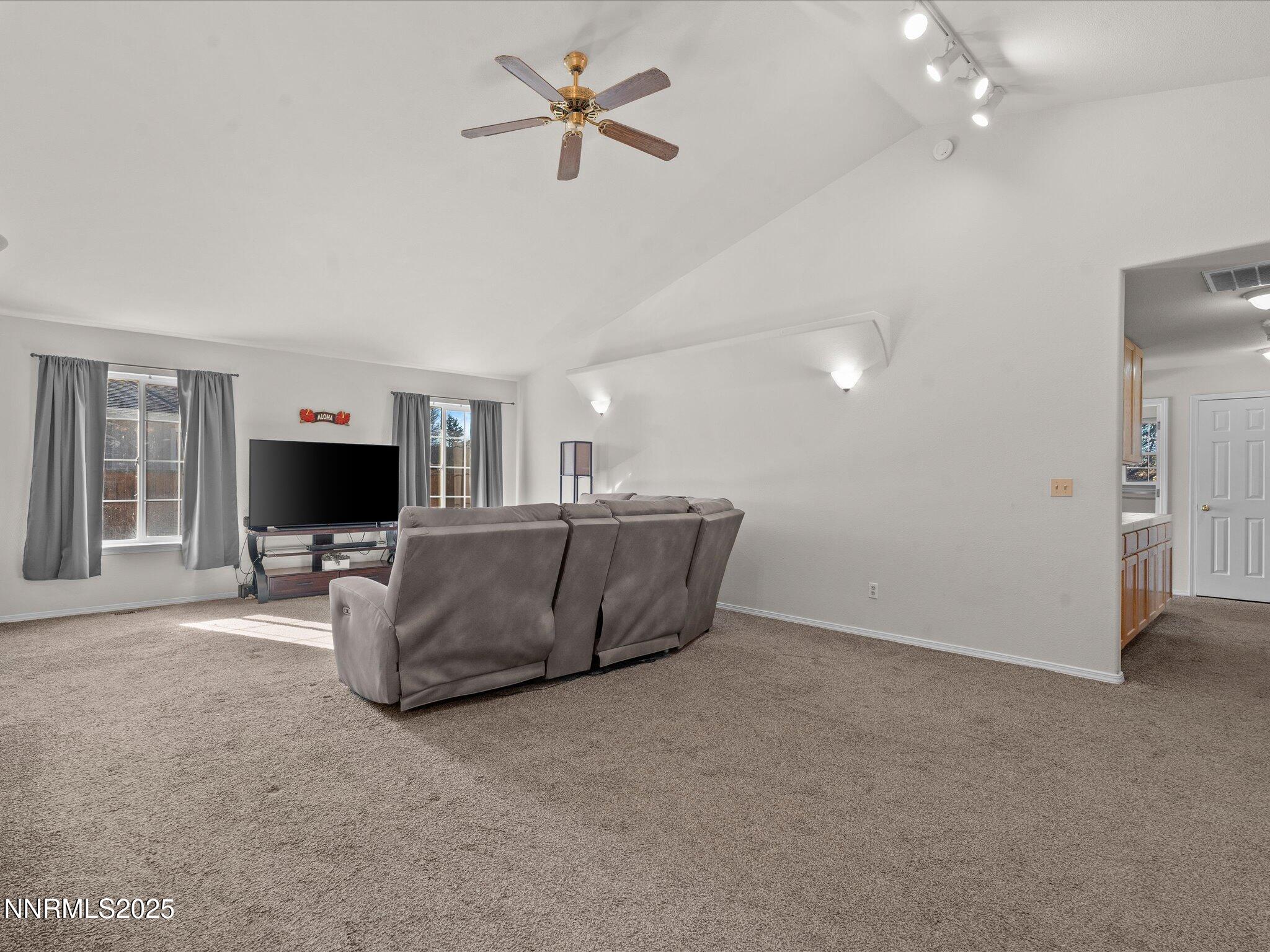 1819 Bogie Court Fernley, NV 89408 - Photo 5 of 46 a living room with furniture and a flat screen tv