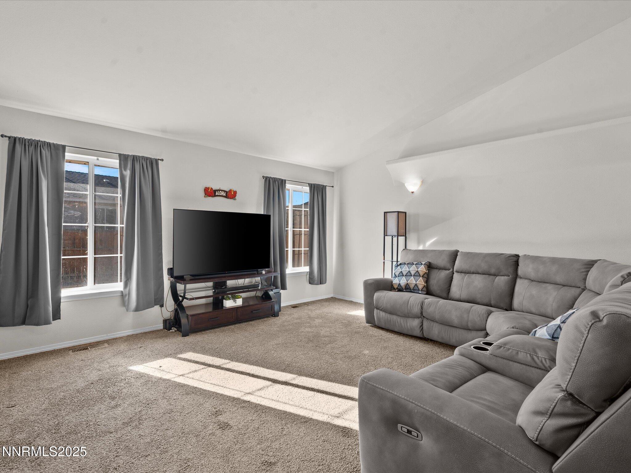 1819 Bogie Court Fernley, NV 89408 - Photo 8 of 46 a living room with furniture and a flat screen tv