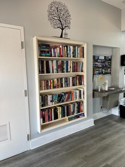6713 Stone River Road, Unit 206 Bradenton, FL 34203 - Photo 41 of 58 a view of a livingroom with shelves