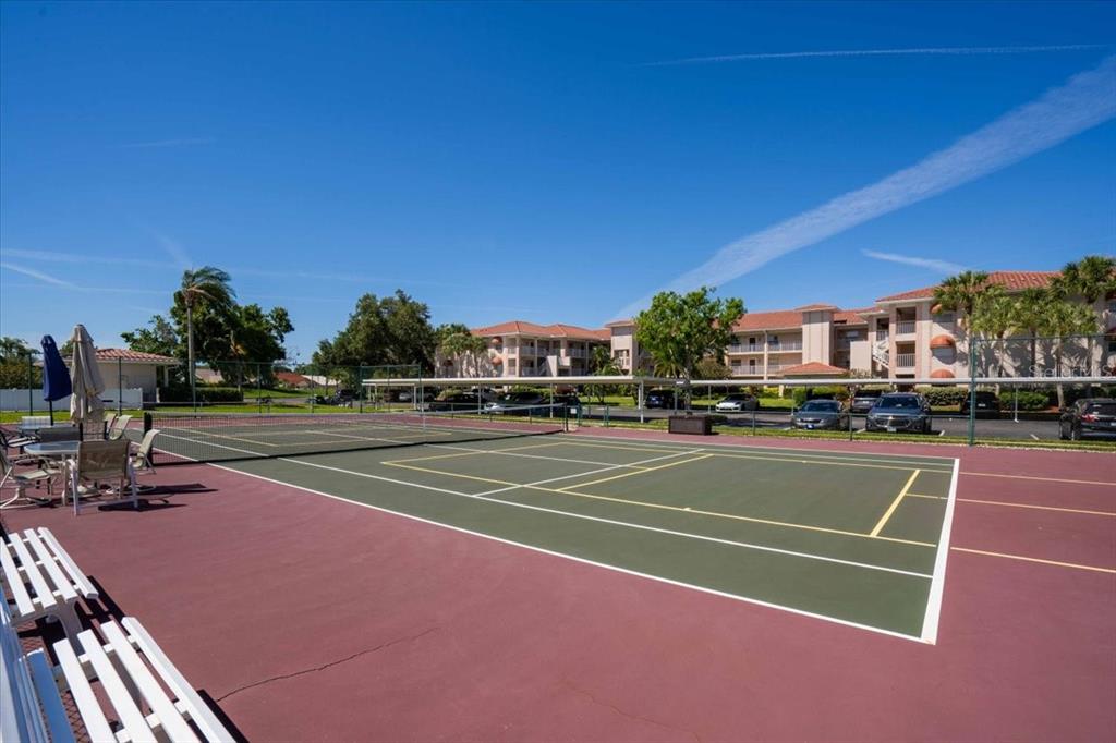 6713 Stone River Road, Unit 206 Bradenton, FL 34203 - Photo 57 of 58 a view of a tennis court