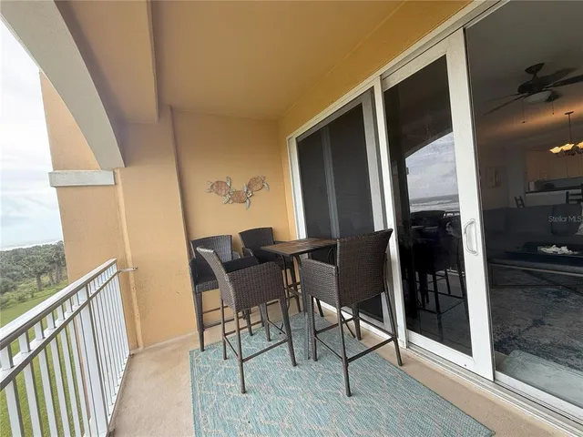 a view of a hallway with wooden floor and outdoor space