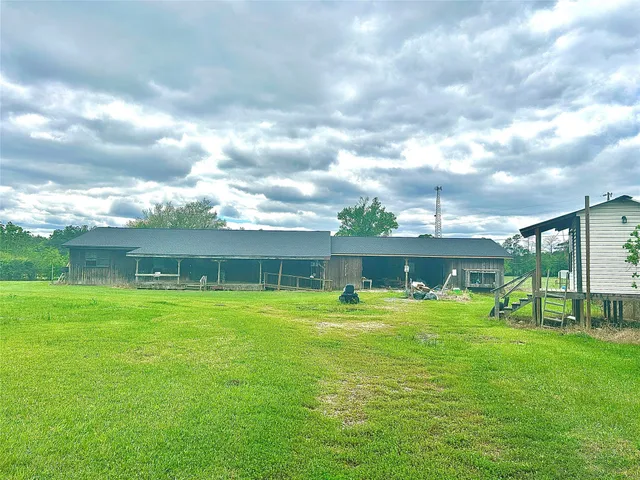 a view of a big yard with a house