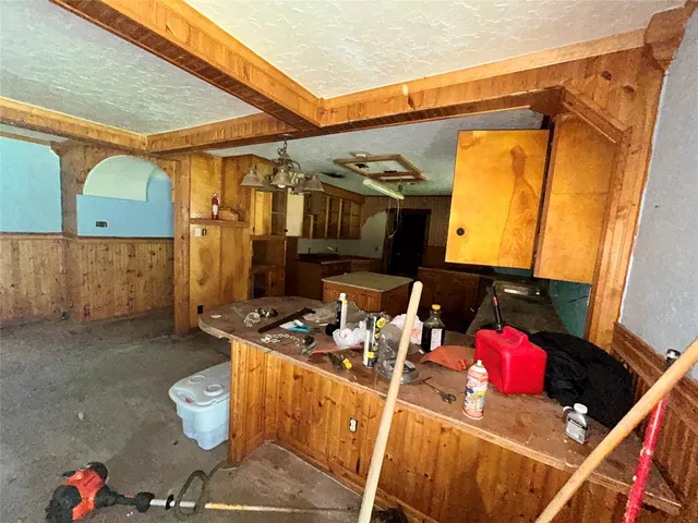 a bathroom with a sink mirror and vanity