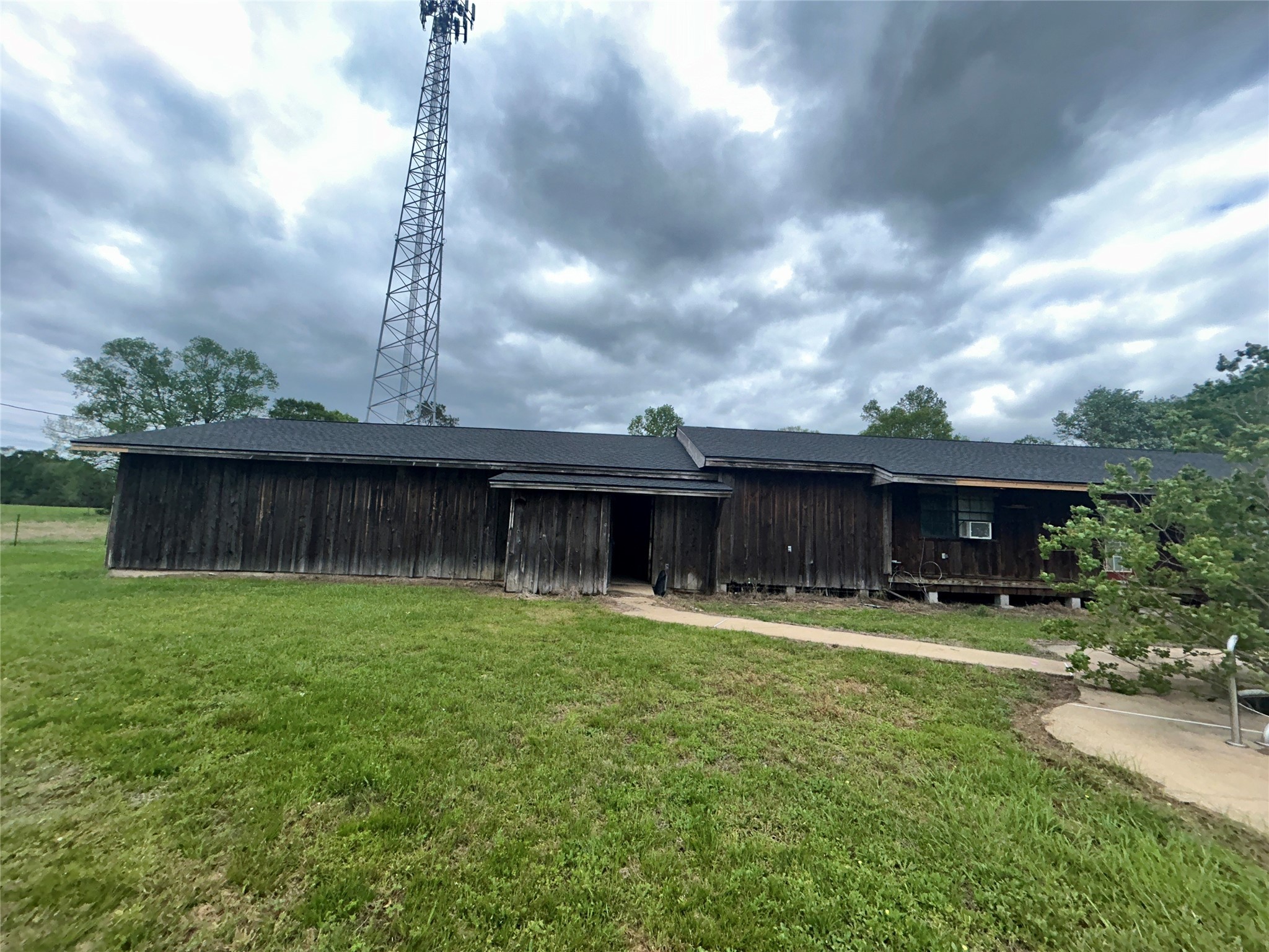 217 County Road 3083 Call, TX 75933 - Photo 2 of 38 a front view of a house with garden