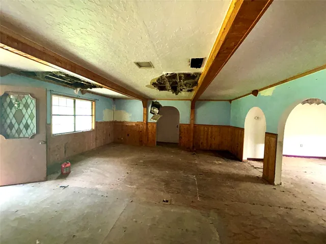 a bathroom with a toilet and shower curtain