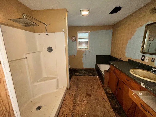 a bathroom with a toilet and a shower curtain