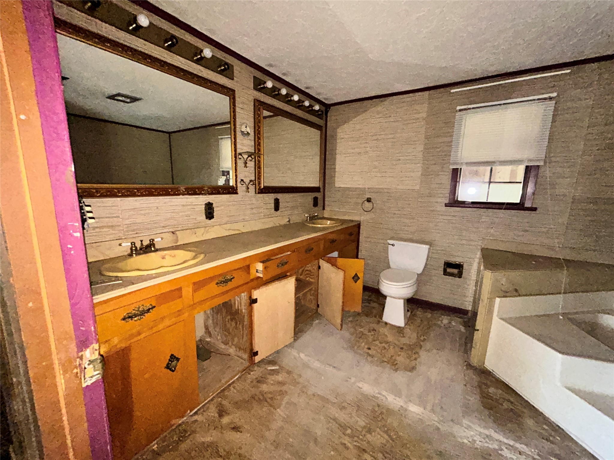 217 County Road 3083 Call, TX 75933 - Photo 25 of 38 a bathroom with a sink a toilet a mirror and shower