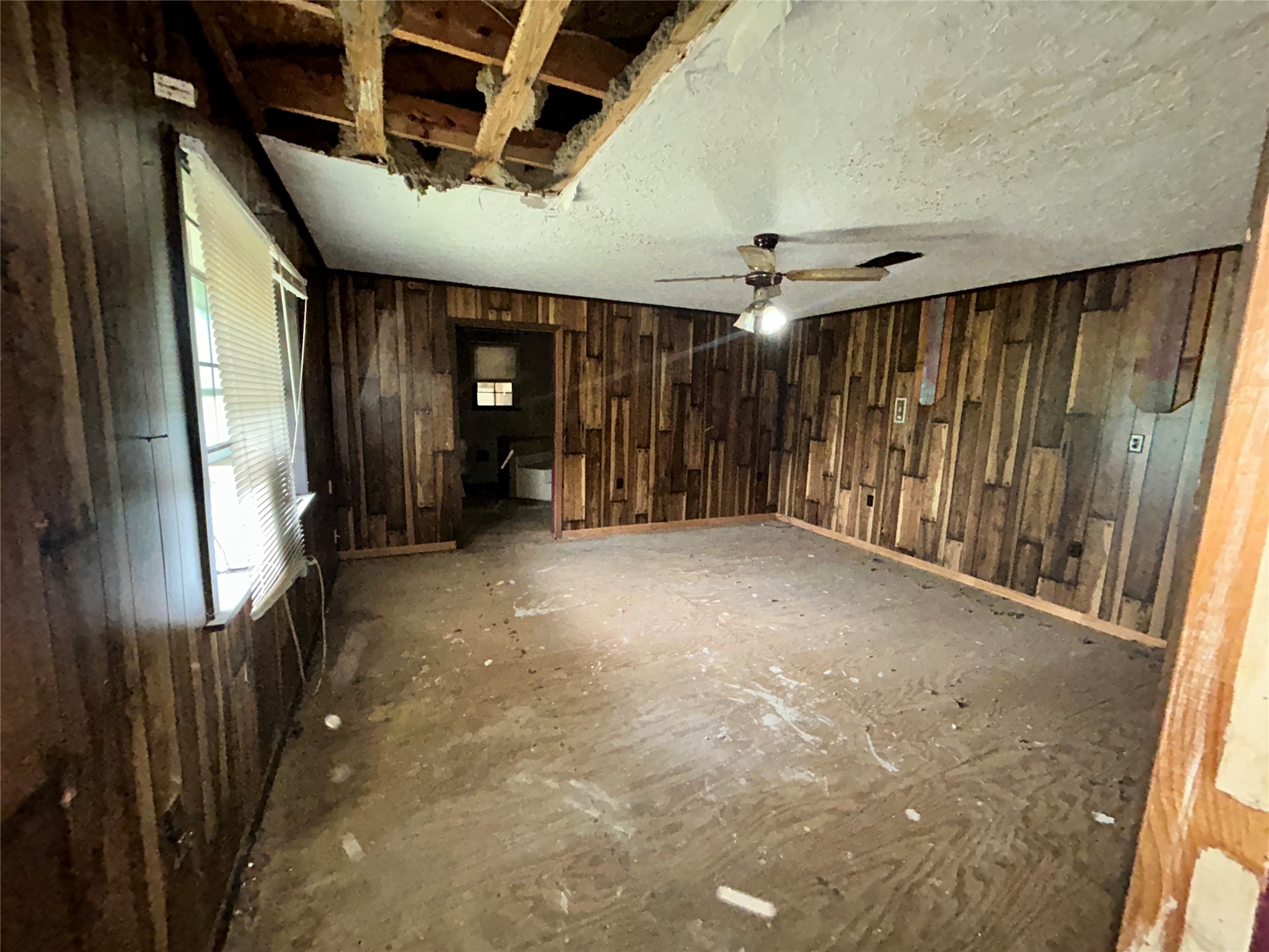 217 County Road 3083 Call, TX 75933 - Photo 31 of 38 a view of a hallway with wooden walls
