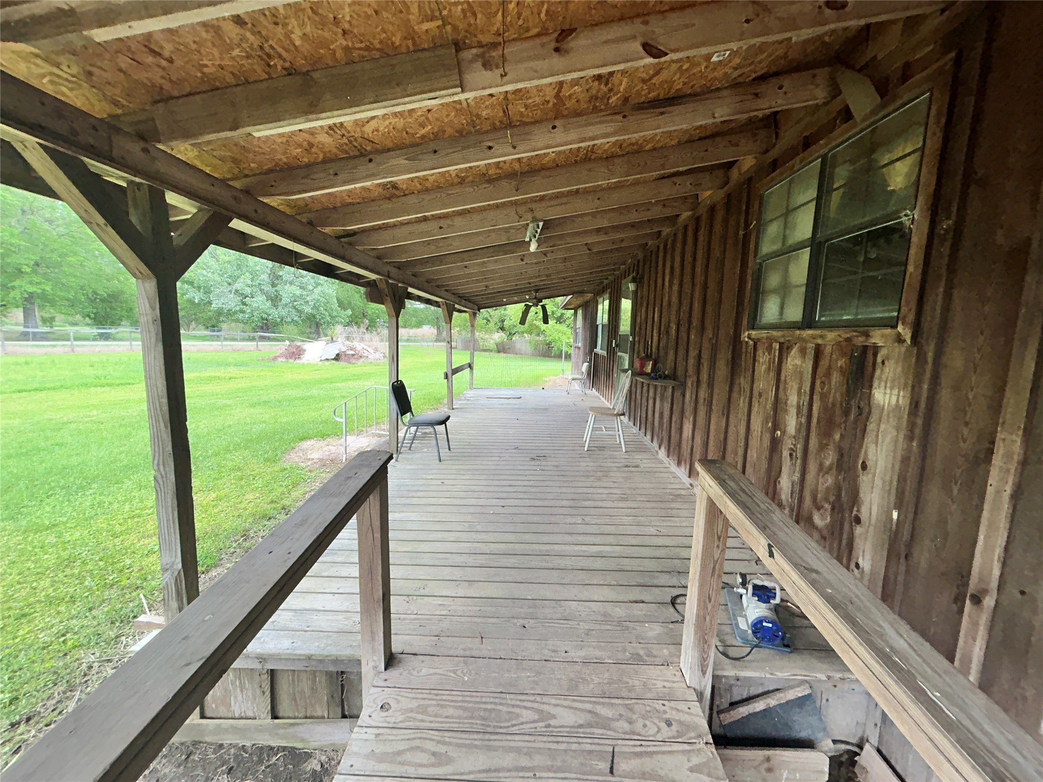217 County Road 3083 Call, TX 75933 - Photo 34 of 38 a view of deck with wooden floor and roof with floor to ceiling windows