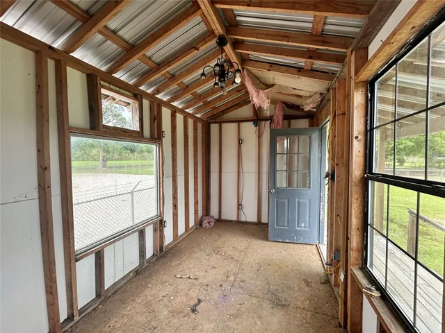 a view of an empty room with a balcony
