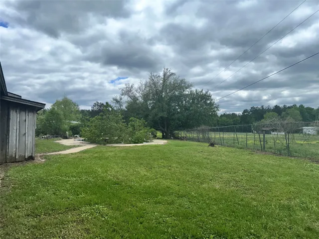 a backyard of a house with lots of green space
