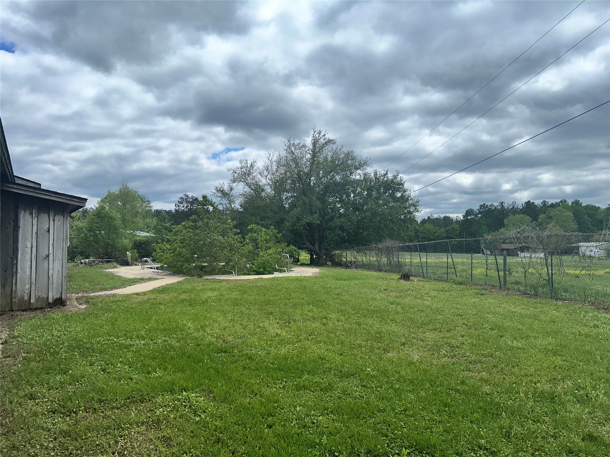 217 County Road 3083 Call, TX 75933 - Photo 9 of 38 a backyard of a house with lots of green space