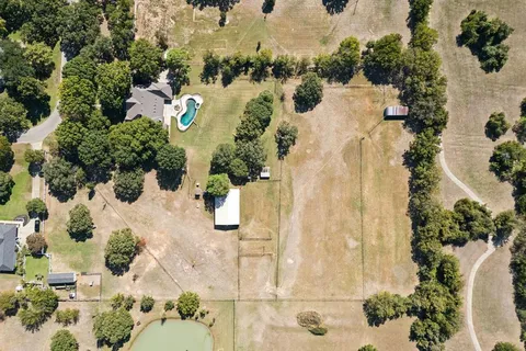 an aerial view of residential house with outdoor space