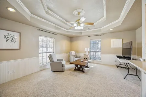 a spacious bedroom with a bed and window