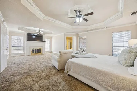 a spacious bathroom with a double vanity sink and a mirror