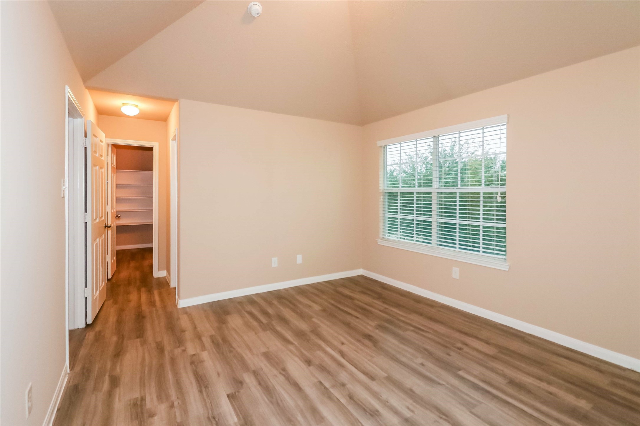 19006 Treviso Terrace Lane Katy, TX 77449 - Photo 10 of 17 an empty room with wooden floor and windows