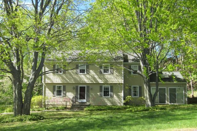 3 Lantern Drive Ridgefield, CT 06877 - Photo 1 of 1 a front view of a house with a garden