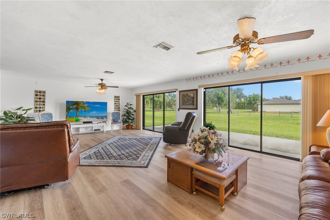 13751 River Road Fort Myers, FL 33905 - Photo 14 of 50 a living room with furniture and a large window