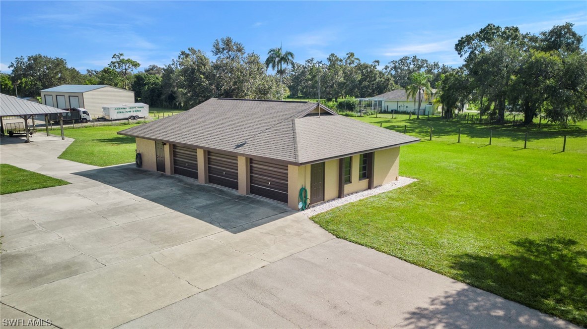 13751 River Road Fort Myers, FL 33905 - Photo 2 of 50 a aerial view of a house with swimming pool and a yard