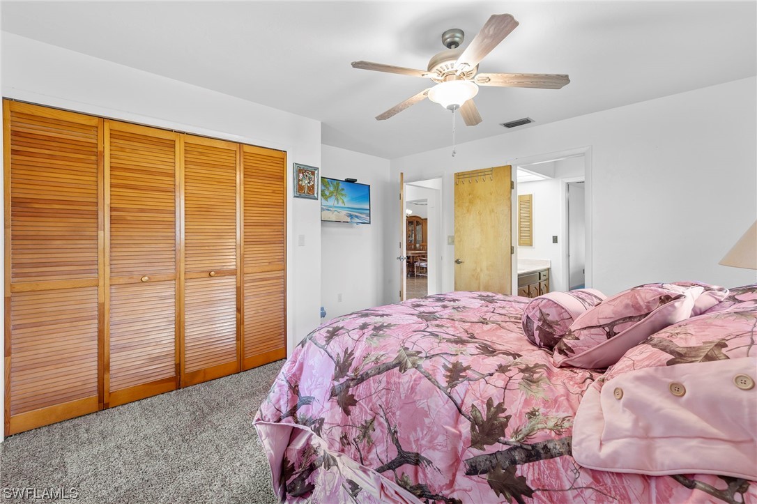 13751 River Road Fort Myers, FL 33905 - Photo 35 of 50 a bedroom with a large bed closet and a large window