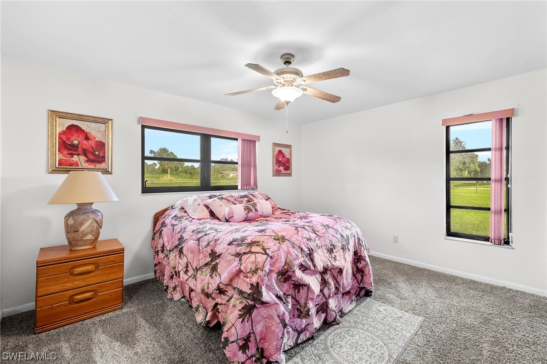 13751 River Road Fort Myers, FL 33905 - Photo 36 of 50 a bedroom with a bed and a window