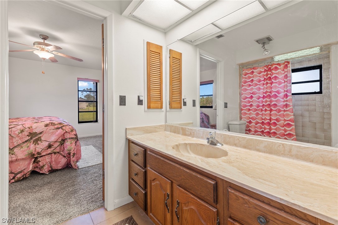 13751 River Road Fort Myers, FL 33905 - Photo 37 of 50 a spacious bathroom with a sink double vanity and a mirror