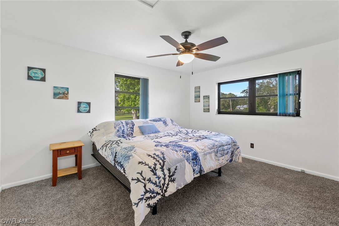 13751 River Road Fort Myers, FL 33905 - Photo 39 of 50 a bedroom with a bed and a window