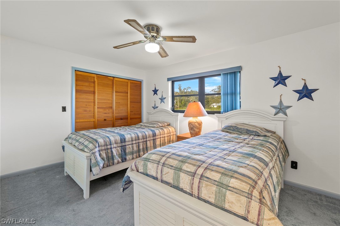 13751 River Road Fort Myers, FL 33905 - Photo 41 of 50 a bedroom with two beds and window