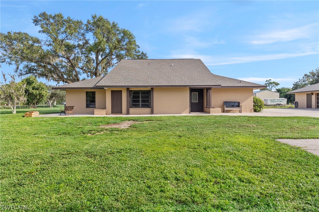 13751 River Road Fort Myers, FL 33905 - Photo 45 of 50 a front view of house with yard and green space