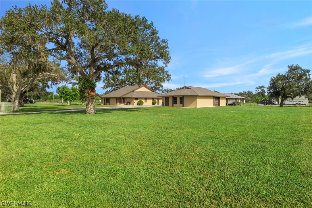 13751 River Road Fort Myers, FL 33905 - Photo 49 of 50 a view of a house with a big yard