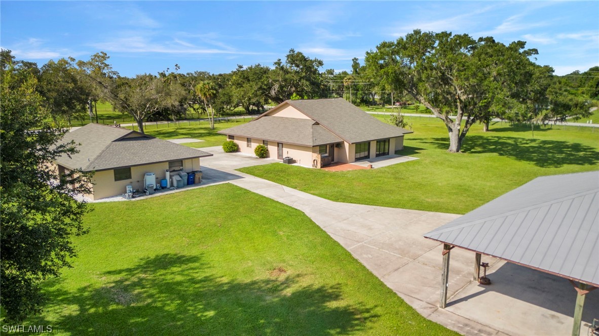 13751 River Road Fort Myers, FL 33905 - Photo 7 of 50 a view of a house with a big yard