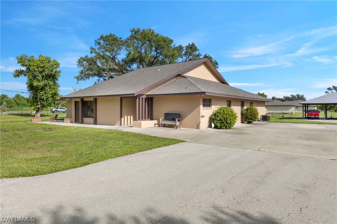 13751 River Road Fort Myers, FL 33905 - Photo 10 of 50 a view of a house with a garden and pathway