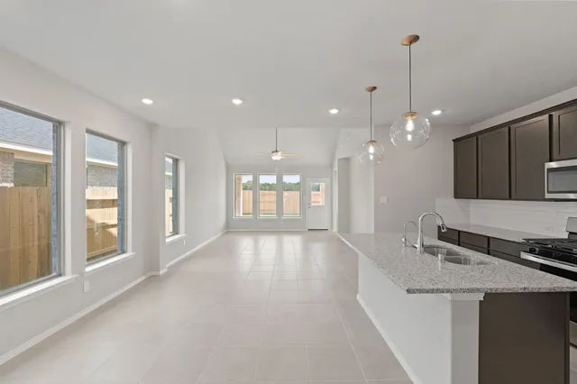 a view of a kitchen with a sink and a window