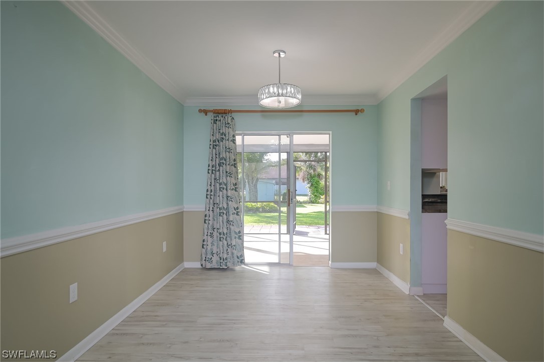 15450 Cemetery Road Fort Myers, FL 33905 - Photo 18 of 29 wooden floor in an empty room with a window