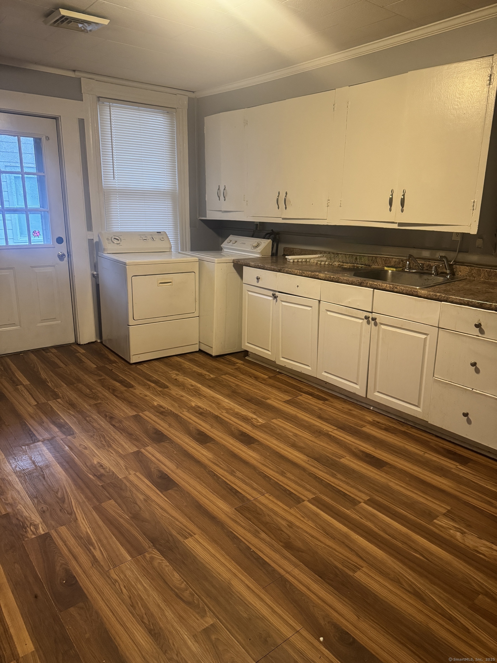 51 Ridge Street, Unit 3 Waterbury, CT 06706 - Photo 1 of 1 a view of a kitchen with wooden floor
