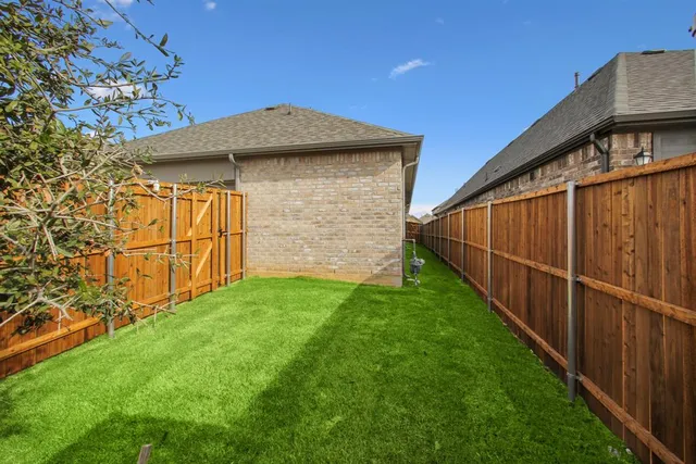 a view of backyard with cabin